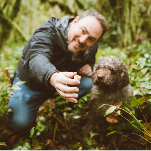 Truffle hunters Stefan and Dog Ella show a truffle they found